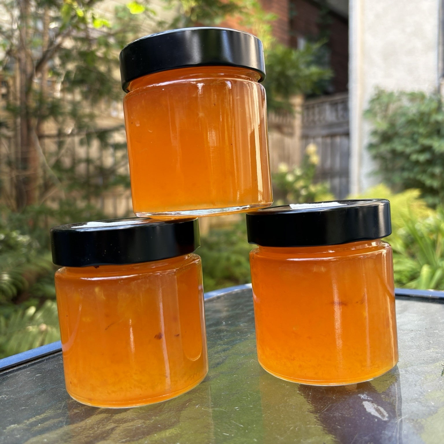 Three jars of peach jam